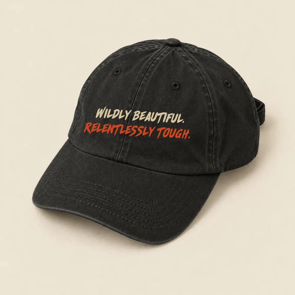 The Backstage Cap, Washed black · two-tone tagline